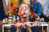 portrait-teenage-girl-blowing-confetti-her-birthday.jpeg