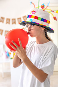 festive-girl-inflates-balloon-her-birthday-birthday-concept.jpeg