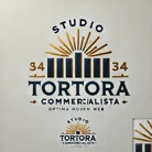 dalle 2024-12-16 18.50.55 - modify the logo for a professional accounting firm, studio tortora commercialista, with gold and navy blue colors. adapt the design to fit cleanly on 