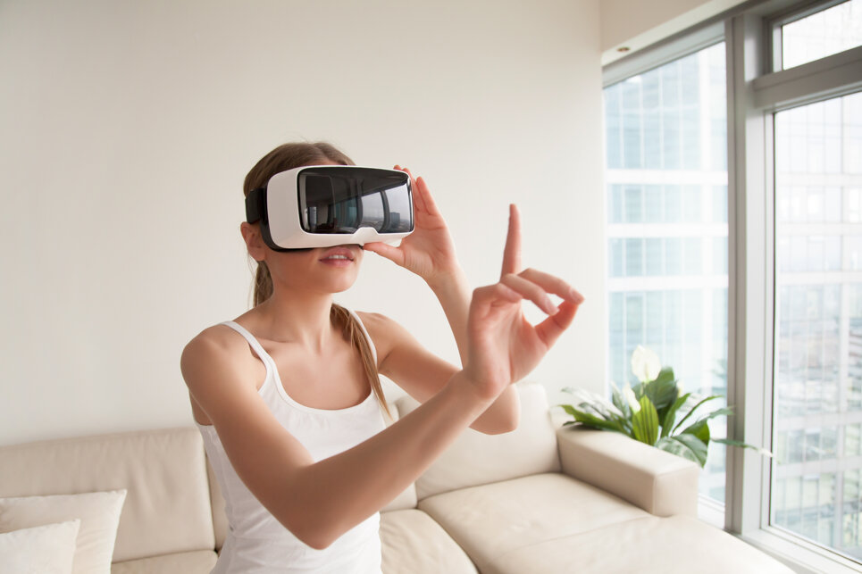 woman-vr-headset-touching-virtual-objects.jpeg