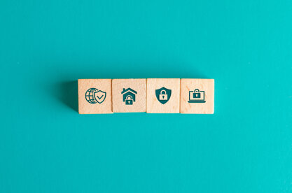 security-concept-with-icons-wooden-blocks-turquoise-table-flat-lay.jpeg