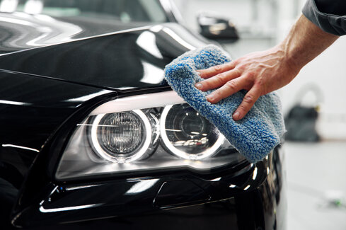 car-detailing-man-holds-microfiber-hand-polishes-car.jpeg