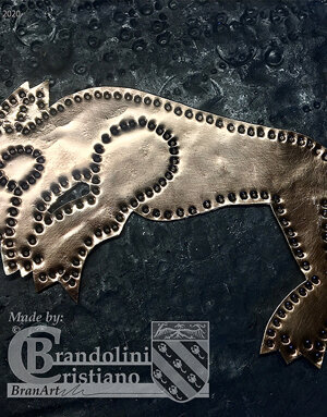 Decorazione in lamina bronzea.