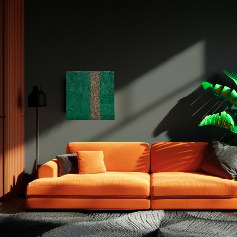 quadro terra su parete salotto con divano arancio