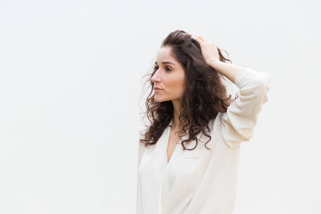 side-pensive-serious-beautiful-woman-touching-hair.jpeg