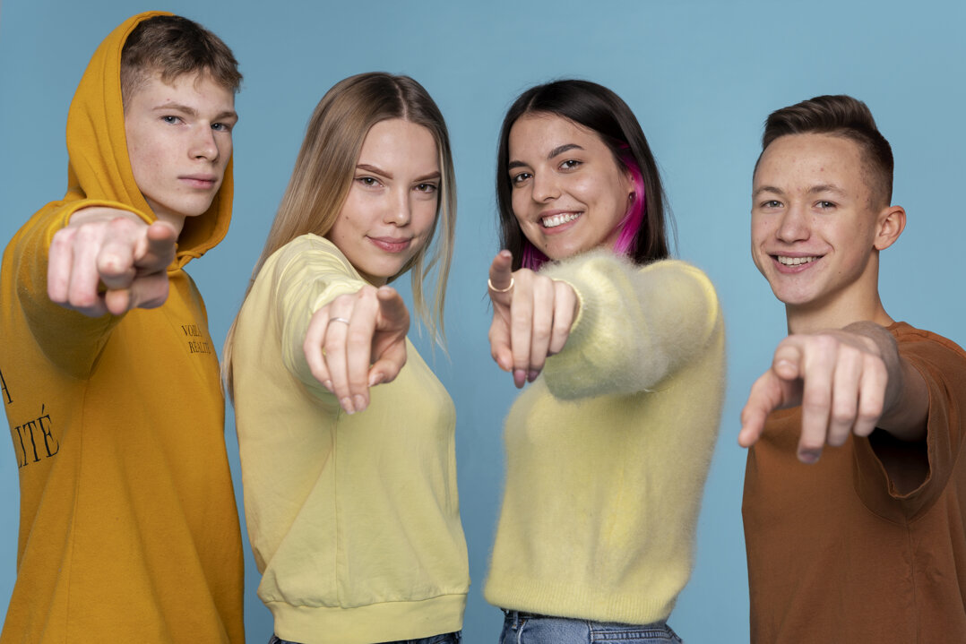 portrait-teenage-friends-pointing-something-front-them.jpeg