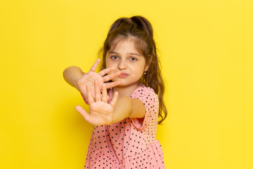 front-view-cute-little-kid-pink-dress-with-cautious-expression.jpeg
