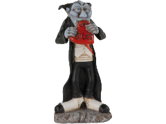 Statuina Les Alpes di un vampiro in stile umoristico, con pelle azzurrognola, lungo mantello nero, panciotto bianco e grandi scarpe bicolore, mentre morde un cuore rosso con la scritta 