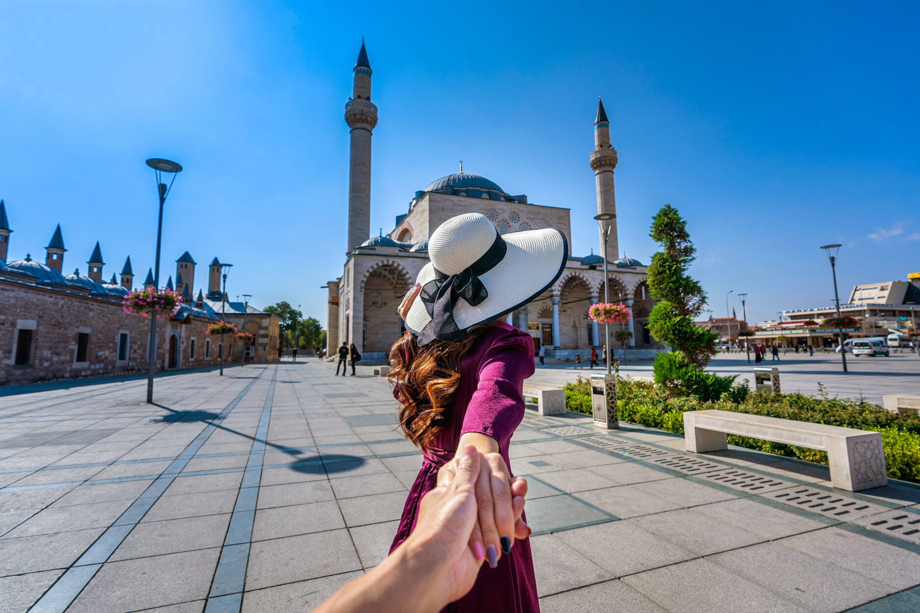 women-tourists-holding-man-s-hand-leading-him-mosque-konya-turkey.jpeg