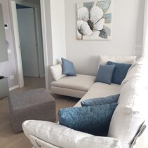 Realizzazione Progetto Arredamento per Interni Vista laterale salotto finito in living open space