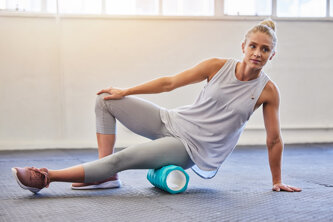fitness-physiotherapy-massage-woman-with-foam-roller-floor-leg-tension-support-yoga-workout-gym-health-pilates-massaging-sports-physio-girl-ground-rolling-muscle.jpeg