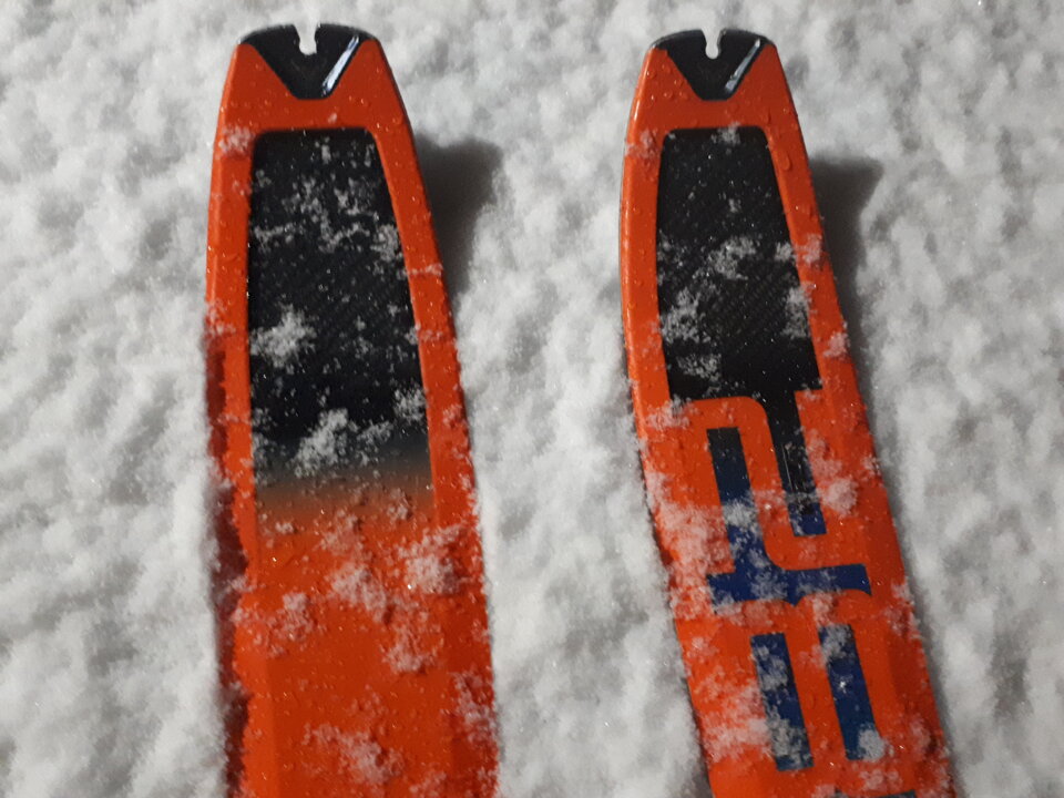 Snow flakes fall on skis