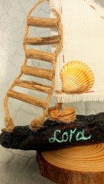 small-driftwood-sailing-boat