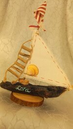 small-driftwood-sailing-boat