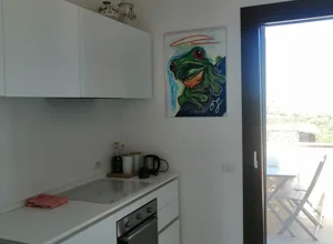 Cucina dell'appartamento con Terrazza vista mare a Stintino Cucina dell'appartamento con Terrazza vista mare a Stintino