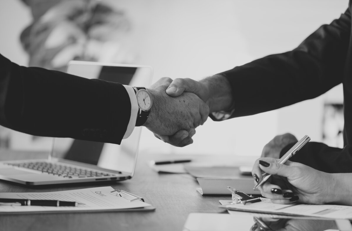 business-people-shaking-hands-together.jpeg