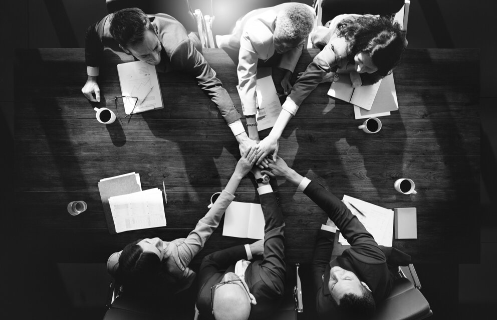 group-diverse-people-with-joining-hands-teamwork.jpeg