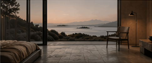 Full-height window framing coastal mountains and the sea