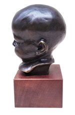 balestrieri-bernardo-18841965-bambino-che-ride-da-un-modello-di-meta-xx-secolo