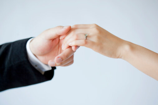 126446628-young-couples-hand-wearing-a-wedding-ring 126446628-young-couples-hand-wearing-a-wedding-ring