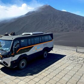 On top of Mount Etna by big off-road vehicles