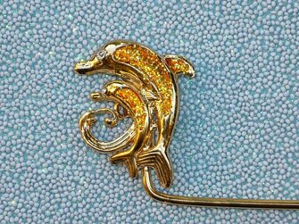 delfini_oro particolare.jpeg delfini_oro particolare.jpeg