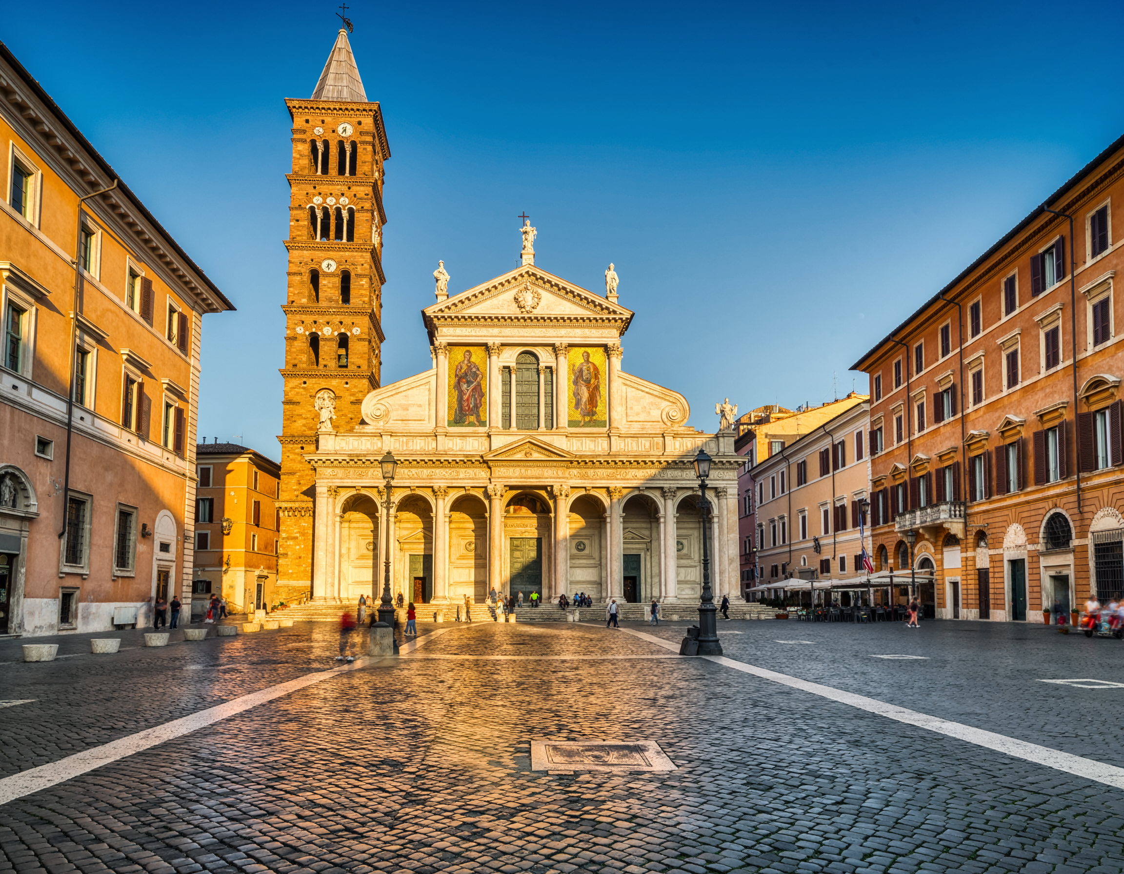 firefly_genera-foto-della-piazza-di-santa-maria-in-trastevere-181349.png