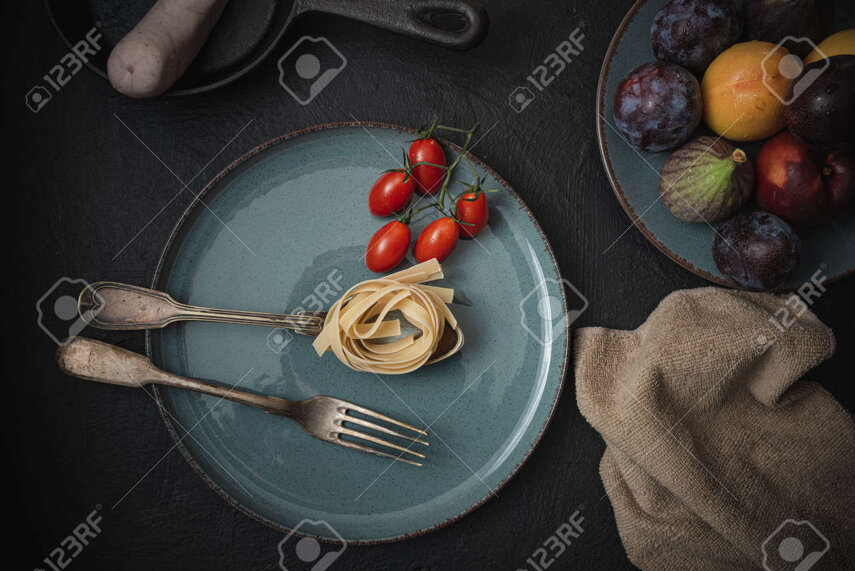 188324105-restaurant-kitchen-utensils-and-food-on-the-table-abstract-background.jpeg