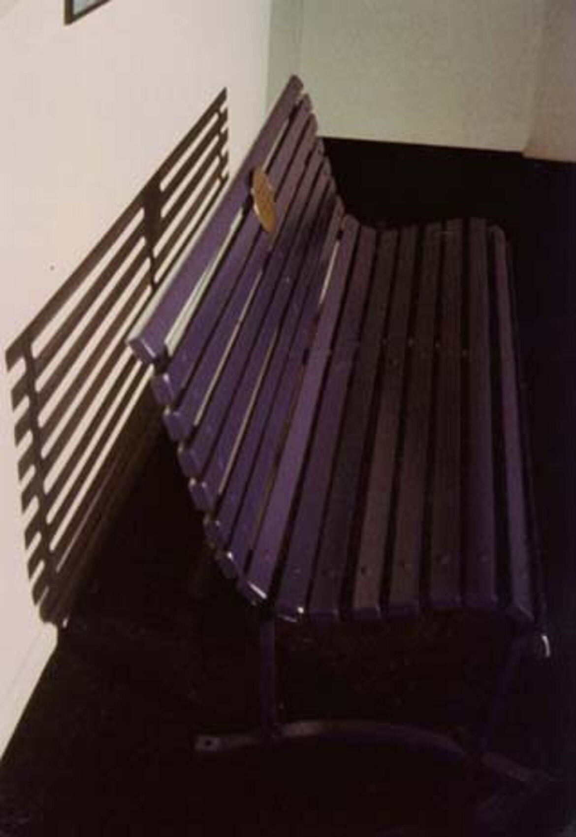 Installation: painted bench, carved brass, photos, video. Palazzo Reale, Milan