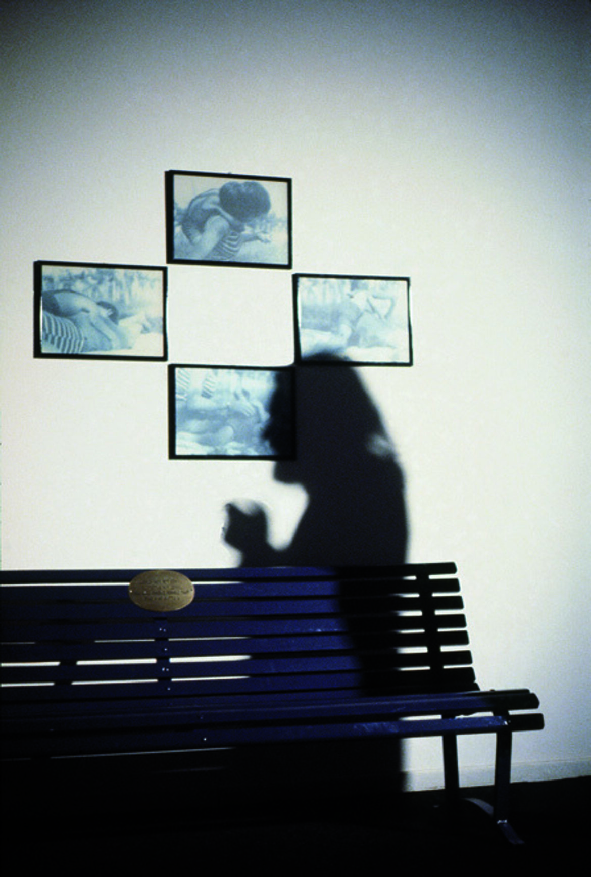 Installation: painted bench, carved brass, photos, video. Palazzo Reale, Milan