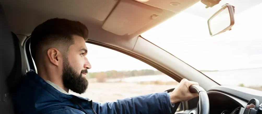 imgi_1_medium-shot-man-driving-car