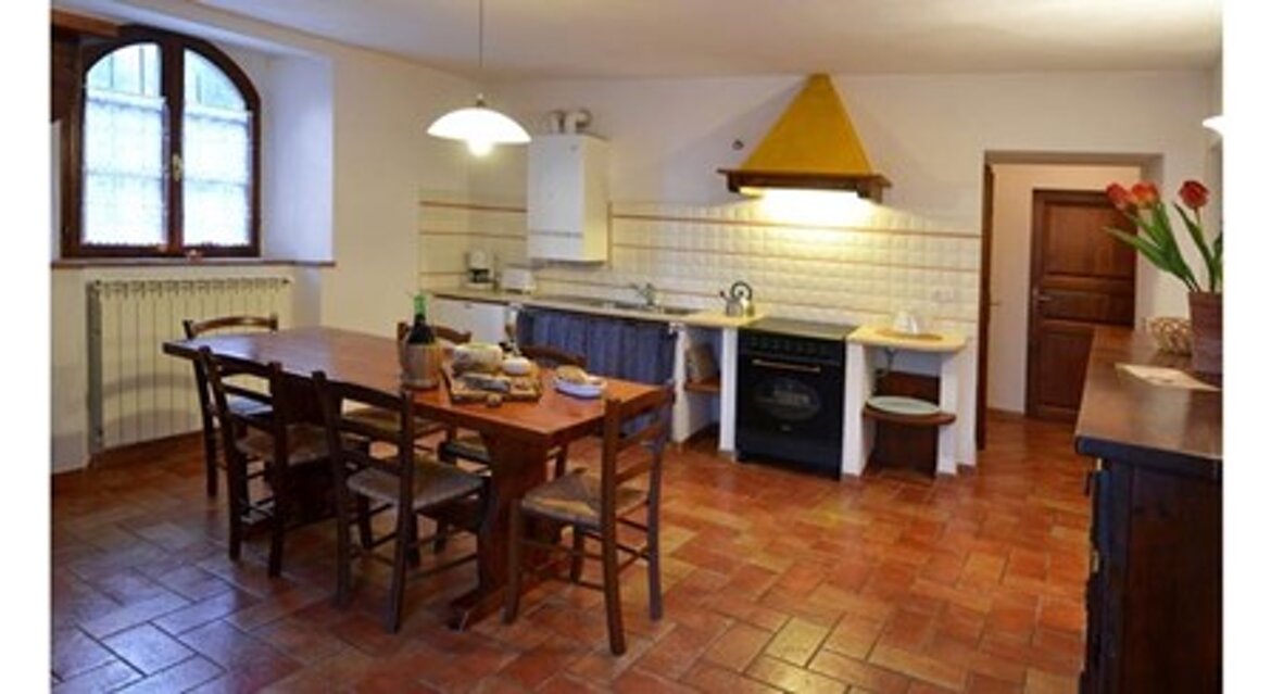 Soggiorno- angolo cottura appartamento Stalla