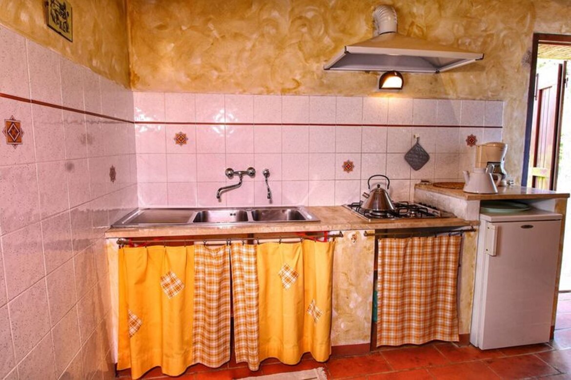Soggiorno -angolo cottura appartamento Granaio