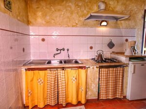 Soggiorno -angolo cottura appartamento Granaio