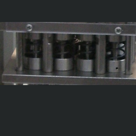 SISTEMA DI CARICO MECCANICO PEZZI IN PROVA