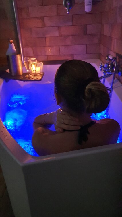 Relaxing in the private Jacuzzi Suite with wine and blue chromotherapy lighting Sassari