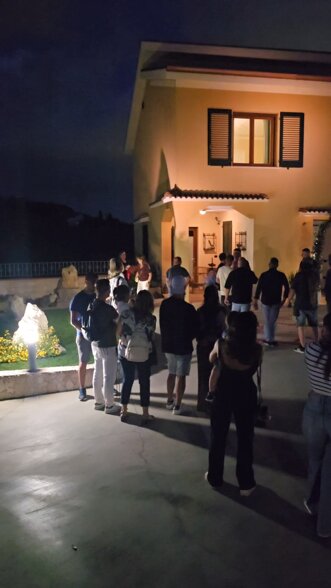 Guests celebrating a private party or baby shower at Villa Malvasio in the evening