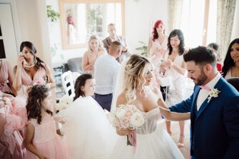 Bride greeting family and friends in the Villa Malvasio lounge before the wedding ceremony