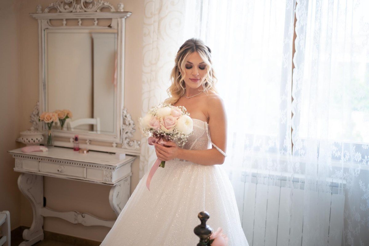 Shooting fotografico della sposa in camera Suite