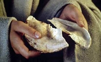 spezzare pane