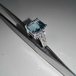 750 white gold ring with aquamarine and diamonds White gold, emerald cut aquamarine, diamonds on the stem