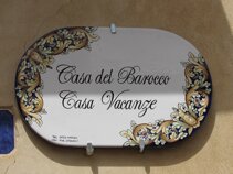 insegna in pietra lavica
