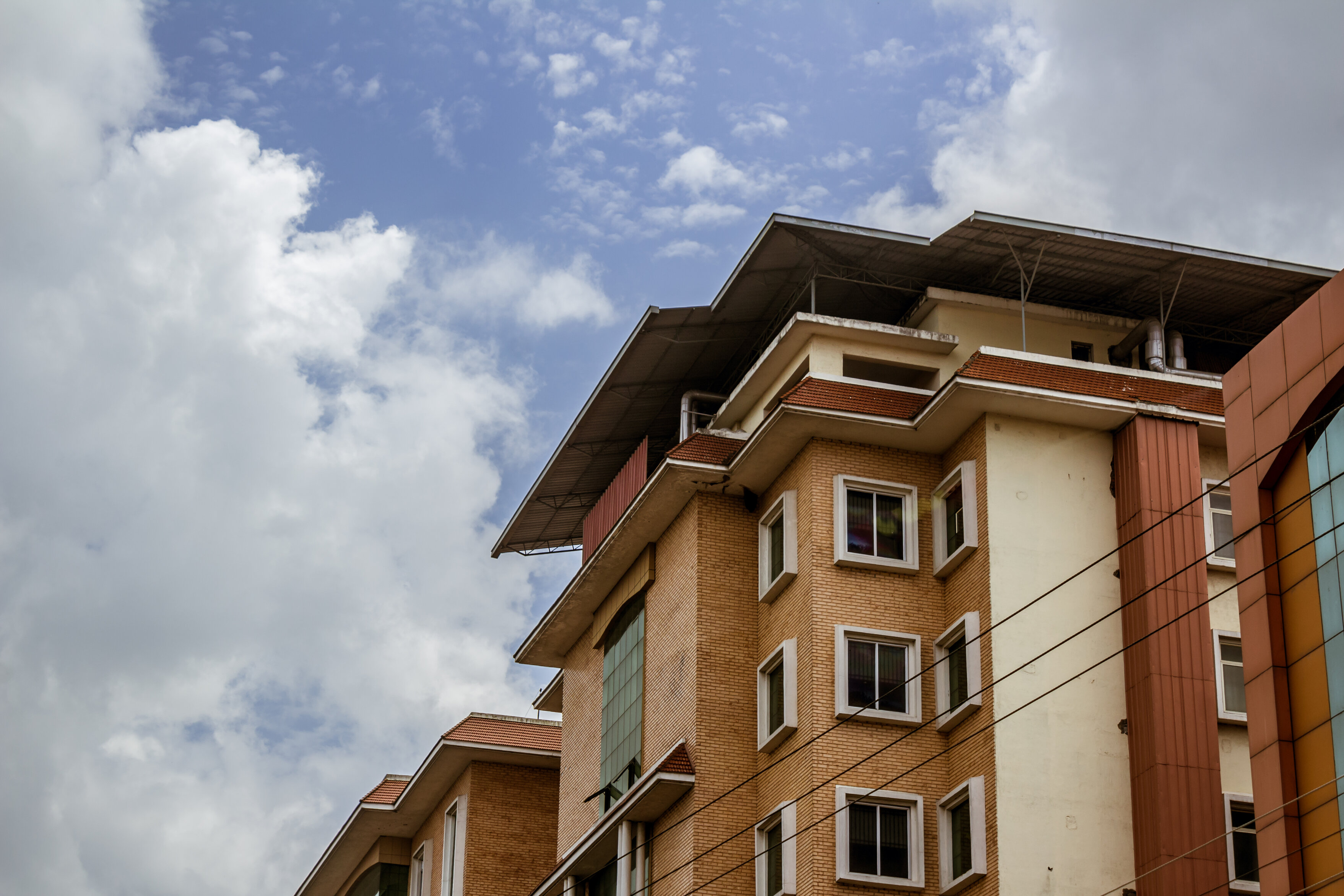 hospital-building-with-clouds-background.jpeg