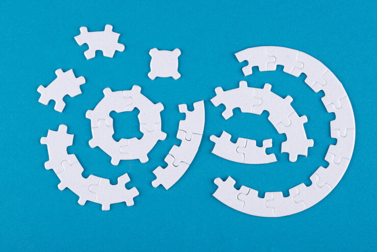 top-view-puzzle-pieces-blue-background.jpeg