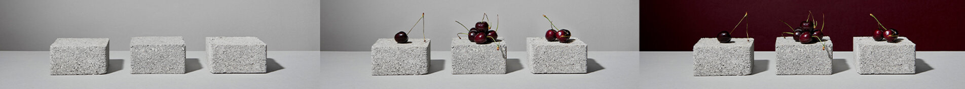 Still life di ciliegie su mattoni grigi