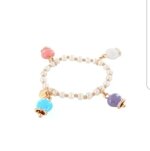 bracciale-elastico-perle-e-campanelle-colorate-rosato