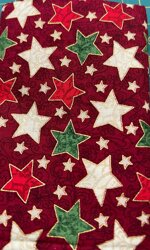 stoffa-stelle-di-natale-fondo-rosso