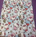 stoffa-hello-kitty-fondo-azzurro