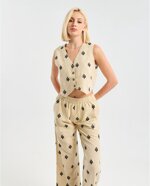 cordinato-gilet-e-pantaloni-con-ricami-neri