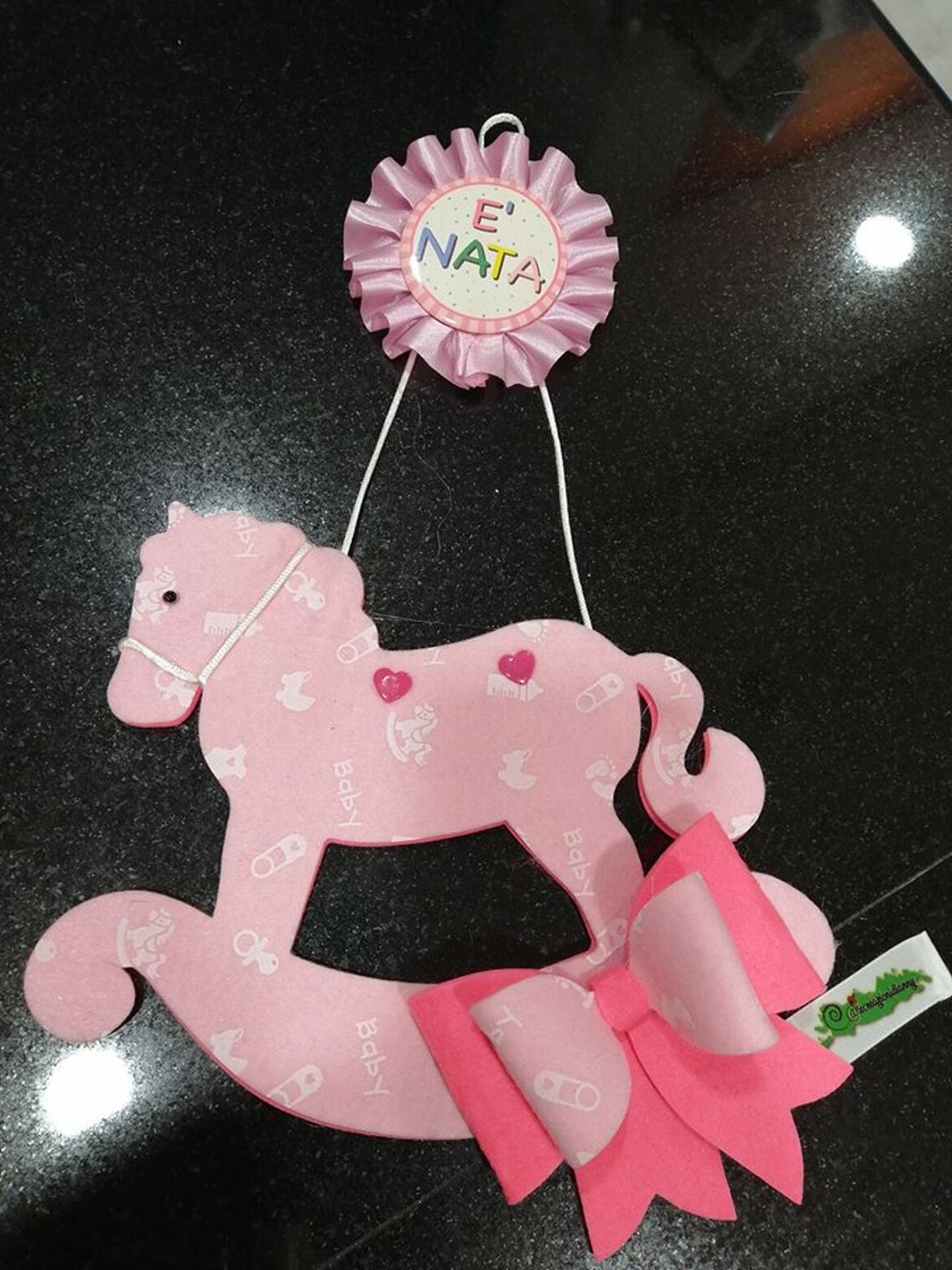 cavalluccio dietro porta nascita bimba nascita